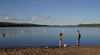 Canada / Kanada - Saskatchewan: young children playing near the water - birds flying above - photo by M.Duffy