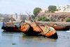 Praia, Santiago island / Ilha de Santiago - Cape Verde / Cabo Verde: run aground boats in Praia harbour - photo by E.Petitalot