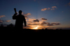 Calshot, Solent, Hampshire, South East England, UK: photographer silhouette at sundown - photo by I.Middleton