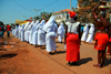 Bissau, Guinea Bissau / Guin Bissau: Amlcar Cabral Avenue, Carnival, women parading with white clothes - former building of the Tax administration / Avenida Amilcar Cabral, carnaval, mulheres a desfilar com traje branco - antigo edifcio da Fazenda de Bissau - photo by R.V.Lopes