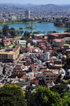 Antananarivo / Tananarive / Tana - Analamanga region, Madagascar: view from the Haute Ville - Ambohidahy district - Anosy Lake, once a swamp, with its War Memorial - Sainte Famille and Saint Michel colleges - Carlton Hotel background - photo by M.Torres