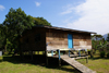 Gunung Mulu National Park, Sarawak, Borneo, Malaysia: wooden house on stilts with access ramp - photo by A.Ferrari