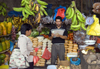 Penonom, Cocl province, Panama:  woman waits for her change while buying produce at the Public Market - photo by H.Olarte