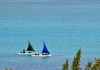 Anse Mourouk, Rodrigues island, Mauritius: pair of fishing boats sail at the start of a new journey - photo by M.Torres