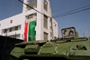 Chechnya, Russia - building, APC, barbed wire, flag of Chechnya and Russian coat of arms - photo by A.Bley