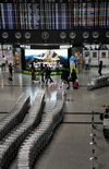 Taipei, Taiwan: baggage carts and departures board at Terminal 2 of Taiwan Taoyuan International Airport - located west of Taipei in Dayuan District, Taoyuan - photo by M.Torres