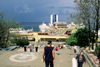 Odessa, Ukraine: people at the top of the Potemkin stairs - view of several cruises ships in the port, the Maritime Station, Hotel Odessa and the Black Sea - photo by K.Gapys