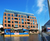 Baltimore, Maryland, USA: cable-stayed bridge over Dugan's Wharf, offices of Ernst and Young and floating restaurant - Inner Harbor - photo by M.Torres