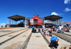 Stone Town, Zanzibar / Unguja, Tanzania: small shipyard - rails, sheds and barge - Malindi area - photo by M.Torres